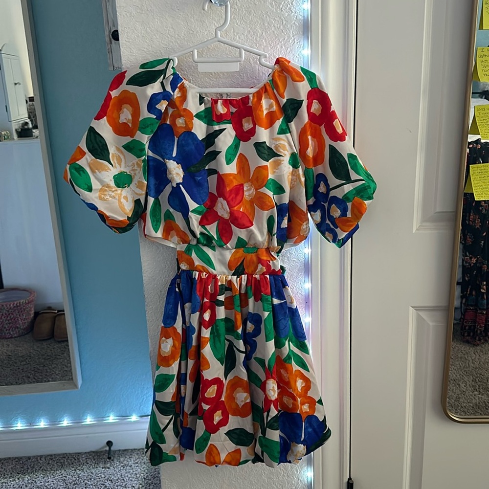 Colorful floral dress with short puffy 
sleeves and adjustable waist with bow